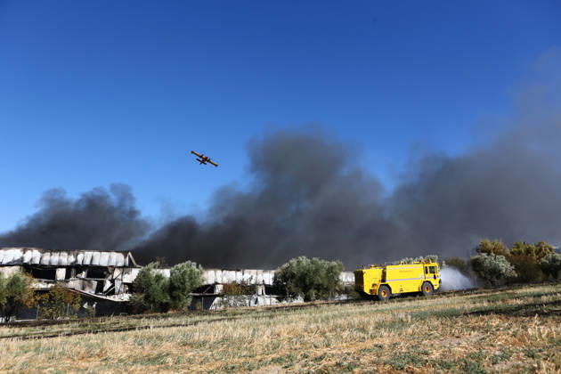 September 5, 2026, Thiva, Voiotia, Greece: A firefighting aircraft flies over the area as a fire engine operates on the ground during efforts to extinguish the fire caused by the crash of a Hellenic Air Force F-4 Phantom. Thiva Greece - ZUMAx103 20260905_zip_x103_011 Copyright: xHarrisxXanthopoulosx