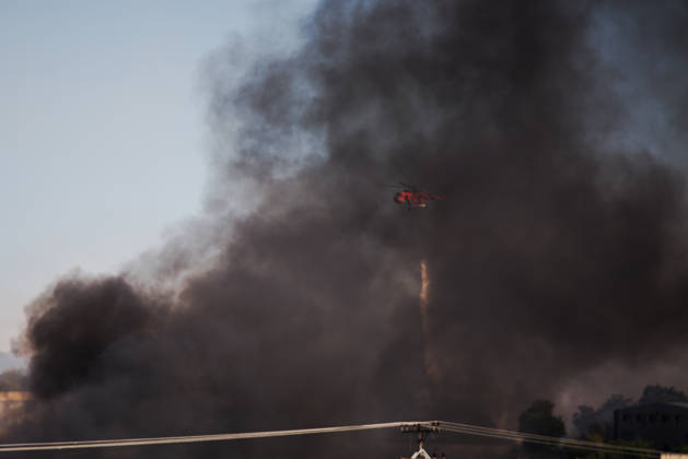 September 5, 2026, Thiva, Voiotia, Greece: A firefighting helicopter operates amid thick black smoke while battling a fire caused by the crash of a Hellenic Air Force F-4 Phantom during the Athens Flying Week air show. Thiva Greece - ZUMAx103 20260905_zip_x103_013 Copyright: xHarrisxXanthopoulosx