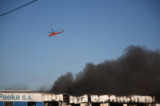 September 5, 2026, Thiva, Voiotia, Greece: A firefighting helicopter flies above thick black smoke during efforts to extinguish the fire caused by the crash of a Hellenic Air Force F-4 Phantom. Thiva Greece - ZUMAx103 20260905_zip_x103_010 Copyright: xHarrisxXanthopoulosx