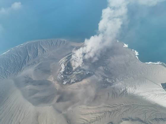 (260906) -- LAMPUNG PROVINCE, Sept. 6, 2026 -- An aerial drone photo provided by Indonesia s Center for Volcanology and Geological Hazard Mitigation () shows volcanic materials spewing from Mount Anak Krakatau in Lampung province, Indonesia, Sept. 6, 2026. Indonesia s Soekarno-Hatta International Airport near Jakarta was temporarily closed early Sunday after volcanic ash from an eruption of Mount Anak Krakatau was detected in the airport area, disrupting dozens of flights, the Ministry of Transportation said. In addition to Soekarno-Hatta International Airport, authorities temporarily closed Halim Perdanakusuma Airport in Jakarta, Budiarto Airport in Curug, Tangerang and Radin Inten II Airport in Lampung. ( Handout via Xinhua) INDONESIA- 