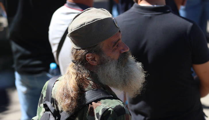07.09.2026 Beograd Belgrade(Serbia) Politics Army war Life Funeral of Ratko Mladic ex general Republic of Srpska army during Bosnian war 1992-1995. Man with controversial hat cap with cockade-badge(front) which marks chetniks for king and fatherland