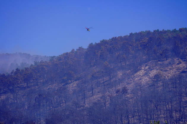 Wildfire in Mugla MUGLA, TURKIYE - SEPTEMBER 7: Firefighting aircraft continue cooling operations after a forest fire that broke out in the Mentese district and spread to the Ula district was largely brought under control following aerial and ground intervention in Mugla, Turkiye, on September 7, 2026. Osman Akca Anadolu Mugla Turkey. Editorial use only. Please get in touch for any other usage.  Copyright: x2026xAnadoluxOsmanxAkcax