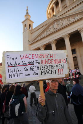 A protester holding a sign that reads Ms. Wagenknecht, don’t become Ms. Hindenburg—don’t help the far right come to power during a rally against the Alternative for Germany (AfD) party following its victory in the state election in Saxony-Anhalt, Alter Markt, Potsdam, September 7, 2026. Rally against the AfD in Potsdam