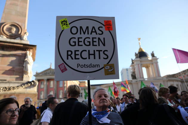 A protester holding a sign reading Omas Gegen Rechts Potsdam during a rally against the Alternative for Germany (AfD) party following its victory in the state election in Saxony-Anhalt, Alter Markt, Potsdam, September 7, 2026. Rally against the AfD in Potsdam