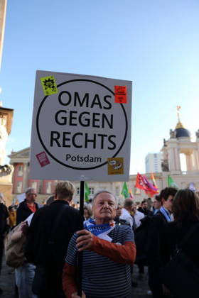A protester holding a sign reading Omas Gegen Rechts Potsdam during a rally against the Alternative for Germany (AfD) party following its victory in the state election in Saxony-Anhalt, Alter Markt, Potsdam, September 7, 2026. Rally against the AfD in Potsdam