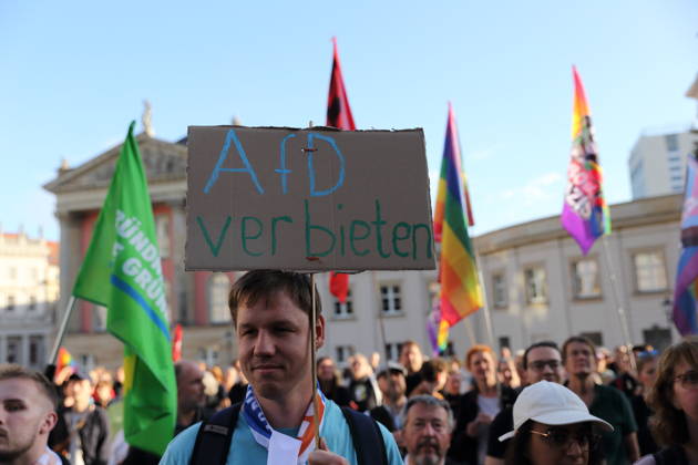 A protester holding a sign reading Ban the AfD during a rally against the Alternative for Germany (AfD) party following its victory in the state election in Saxony-Anhalt, Alter Markt, Potsdam, September 7, 2026. Rally against the AfD in Potsdam