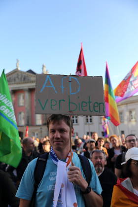 A protester holding a sign reading Ban the AfD during a rally against the Alternative for Germany (AfD) party following its victory in the state election in Saxony-Anhalt, Alter Markt, Potsdam, September 7, 2026. Rally against the AfD in Potsdam