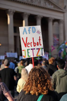 A protester holding a sign reading Ban the AfD Now during a rally against the Alternative for Germany (AfD) party following its victory in the state election in Saxony-Anhalt, Alter Markt, Potsdam, September 7, 2026. Rally against the AfD in Potsdam