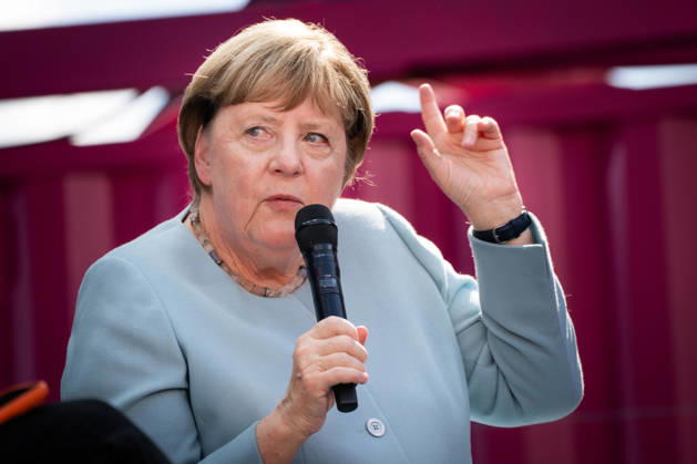 Digital X 2026: Dr. Angela Merkel, former German Chancellor, speaks with her hand raised on the Harbour Stage at Digital X 2026. DIGITAL X is Europe’s leading cross-industry digitalization initiative. With