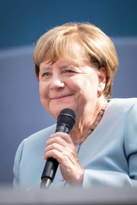 Digital X 2026: Dr. Angela Merkel, German Chancellor, smiling on the Harbour Stage at Digital X 2026. DIGITAL X is Europe’s leading cross-industry digitalization initiative. With the goal of driving digital transformation i