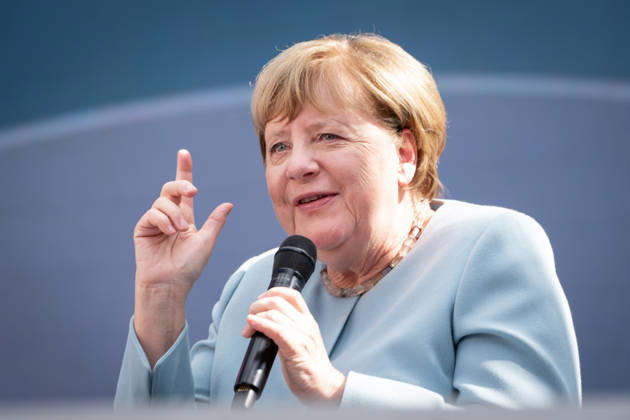 Digital X 2026: Dr. Angela Merkel, former German Chancellor, with her index finger raised, smiling on the Harbour Stage at Digital X 2026. DIGITAL X is Europe’s leading cross-industry digitalizati