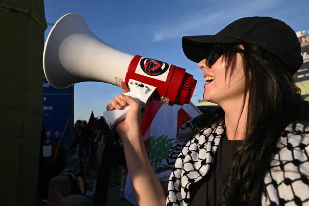 Anti-Israel Rally Outside Opening Day Of MSPO 2026 Defense Salon In Kielce KIELCE, POLAND - SEPTEMBER 8: An anti-Israel activist wearing a traditional keffiyeh and a black cap shouts slogans through a handheld megaphone during a demonstration organized by the Expos Without Criminals ( Targi Bez Zbrodniarzy ) coalition outside the Targi Kielce exhibition center gates to demand the exclusion of Israeli weapons companies on the opening day of the 34th International Defence Industry Exhibition (MSPO) on September 8, 2026. Kielce Poland  Copyright: xArturxWidakx originalFilename: widak-antiisra260908_npXe5.jpg