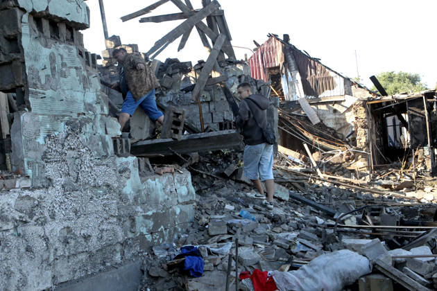 People inspect a private house destroyed in a Russian drone attack, Dnipro, Ukraine, September 9, 2026. On Wednesday night, September 9, Russian drones struck the eastern Ukrainian city. The attack caused fires at warehouses storing building materials and at a private house. Rescuers freed three people, including a 15-year-old boy, from the basement of the damaged home. A 51-year-old man and a 52-year-old woman were taken to hospital. (Photo by Mykola Miakshykov Ukrinform) Aftermath of Russian drone attack in Dnipro  Copyright: xMykolaxMiakshykovx