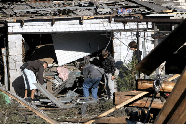 Aftermath of Russian Drone Attack - Dnipro Teenage boys inspect a private house destroyed in a Russian drone attack, Dnipro, Ukraine, September 9, 2026. On Wednesday night, September 9, Russian drones struck the eastern Ukrainian city. The attack caused fires at warehouses storing building materials and at a private house. Rescuers freed three people, including a 15-year-old boy, from the basement of the damaged home. A 51-year-old man and a 52-year-old woman were taken to hospital. Photo by Mykola Miakshykov Ukrinform ABACAPRESS.COM Dnipro Ukraine  Copyright: xMadiyevskyyxVyacheslav Ukrinformx
