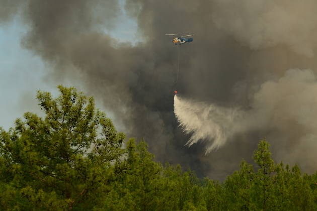 Firefighting efforts continue against wildfire in Turkiye s Antalya ANTALYA, TURKIYE - SEPTEMBER 09: A firefighting aircraft drops water over a wildfire that broke out in a forested area in Antalya s Aksu and Kepez districts on the evening of September 07 and spread across a wide area, as firefighting efforts continue from the air and on the ground in Antalya, Turkiye, on September 09, 2026. Orhan Cicek Anadolu Antalya Turkey. Editorial use only. Please get in touch for any other usage.  Copyright: x2026xAnadoluxOrhanxCicekx