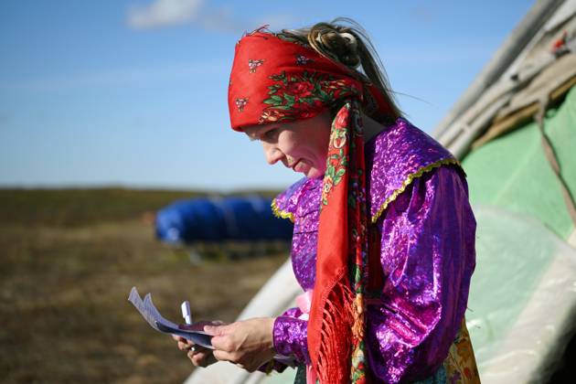 Russia Parliamentary Election Early Voting 9239449 09.09.2026 A member of a local indigenous community reads a ballot during the early voting in remote areas ahead of State Duma elections at a reindeer camping ground, in Yamalo-Nenets Autonomous Area, Russia. Russians will vote in State Duma, the lower house of parliament, and municipal elections over three days, from September 18-20. Alexandr Kryazhev Sputnik Yamalo-Nenets Autonomous Area Russia  Copyright: xAlexandrxKryazhevx