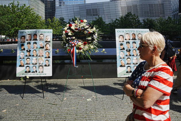 September 9, 2026, New York, New York, USA: Visitors look over a memorial and flower arrangement to the NYPD along the South Tower reflecting pool ahead of the 25th anniversary of the attacks of September 11 at the 9 11 Memorial on September 9, 2026 in New York. New York USA - ZUMAb148 20260909_zap_b148_032 Copyright: xBryanxSmithx