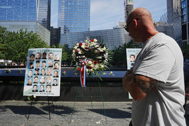 September 9, 2026, New York, New York, USA: Visitors look over a memorial and flower arrangement to the NYPD along the South Tower reflecting pool ahead of the 25th anniversary of the attacks of September 11 at the 9 11 Memorial on September 9, 2026 in New York. New York USA - ZUMAb148 20260909_zap_b148_035 Copyright: xBryanxSmithx