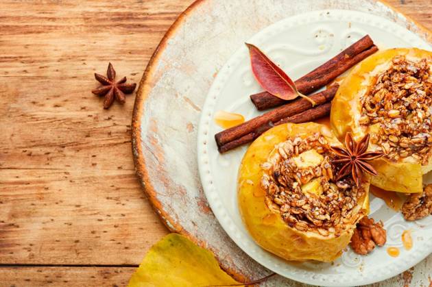 Baked apples stuffed with granola and nuts.Baking concept Copyright: xLMykolax Panthermedia80136938