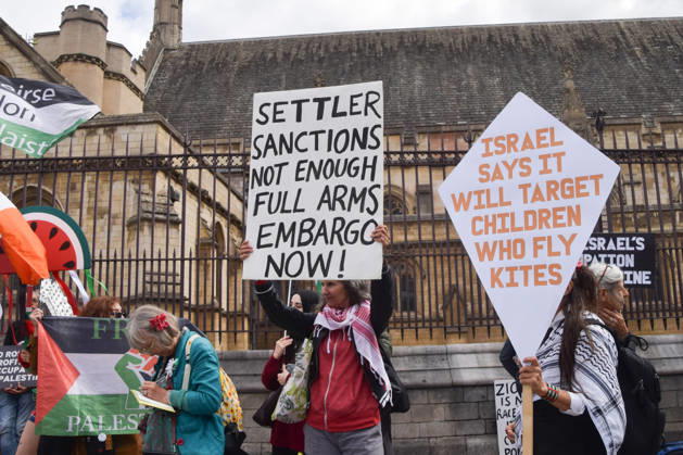 September 9, 2026, London, England, United Kingdom: An activist holds a placard stating Settler sanctions not enough, full arms embargo now as protesters gather in Parliament Square in support of Palestine and against what the protesters call a pro-Israel and Zionist influence in UK politics. London United Kingdom  - ZUMAv130 20260909_zip_v130_100 Copyright: xVukxValcicx