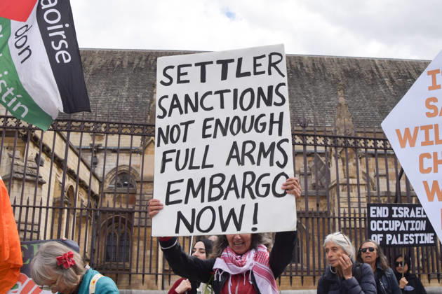 September 9, 2026, London, England, United Kingdom: An activist holds a placard stating Settler sanctions not enough, full arms embargo now as protesters gather in Parliament Square in support of Palestine and against what the protesters call a pro-Israel and Zionist influence in UK politics. London United Kingdom - ZUMAv130 20260909_zip_v130_101 Copyright: xVukxValcicx
