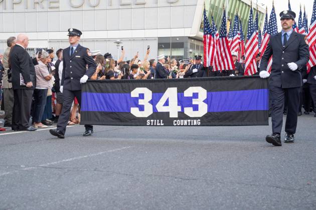 September 9, 2026, New York, New York, USA: Members of FDNY walked with 343 American flags for each member who sacrificed their live on September 11, 2001 during memorial service to commemorate 25th anniversary of terrorist attack on World Trade Center in New York. Service was held at FerryHawks Stadium of Staten Island Borough, New York, NY on September 9, 2026. FDNY members, families of those how perished on that day and who died after of illnesses related to their work in the rescue and recovery efforts, members of fire departments from around the country as well as firefighters from Italy and France attended the service. New York USA - ZUMAr339 20260909_znp_r339_014 Copyright: xLevxRadinx