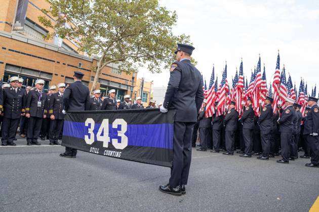 September 9, 2026, New York, New York, USA: Members of FDNY walked with 343 American flags for each member who sacrificed their live on September 11, 2001 during memorial service to commemorate 25th anniversary of terrorist attack on World Trade Center in New York. Service was held at FerryHawks Stadium of Staten Island Borough, New York, NY on September 9, 2026. FDNY members, families of those how perished on that day and who died after of illnesses related to their work in the rescue and recovery efforts, members of fire departments from around the country as well as firefighters from Italy and France attended the service. New York USA - ZUMAr339 20260909_znp_r339_015 Copyright: xLevxRadinx