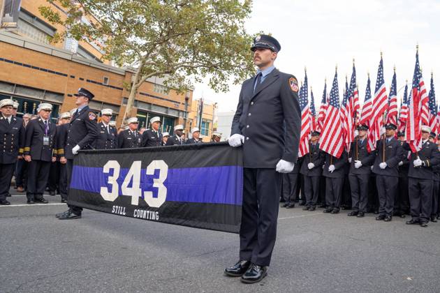 September 9, 2026, New York, New York, USA: Members of FDNY walked with 343 American flags for each member who sacrificed their live on September 11, 2001 during memorial service to commemorate 25th anniversary of terrorist attack on World Trade Center in New York. Service was held at FerryHawks Stadium of Staten Island Borough, New York, NY on September 9, 2026. FDNY members, families of those how perished on that day and who died after of illnesses related to their work in the rescue and recovery efforts, members of fire departments from around the country as well as firefighters from Italy and France attended the service. New York USA - ZUMAr339 20260909_znp_r339_016 Copyright: xLevxRadinx