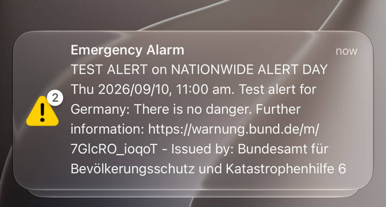 Germany, Europe: Close-up of a cell broadcast test alert on a smartphone during the nationwide alert day. The emergency alert from the Federal Office for Civil Protection and Disaster Assistance (BBK) provides information about a test alert with no actual danger. Stock image related to civil protection, disaster response, warning systems, crisis preparedne Copyright: xAymanxAlahmedx