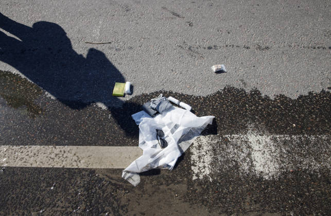Sunglasses of a person injured in a Russian drone attack on a petrol station in the Holosiivskyi district lie on the ground, Kyiv, Ukraine, September 10, 2026. Russian forces targeted the petrol station, injuring four people. A car caught fire on the premises, and a public transport stop was also damaged.(Photo by Marianna Kotyk Ukrinform) Russian drone strikes petrol station in Kyiv’s Holosiivskyi district  Copyright: xMariannaxKotykx