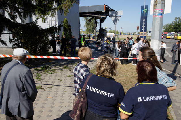 Workers and onlookers stand outside a petrol station attacked by a Russian drone in the Holosiivskyi district of Kyiv, Ukraine, September 10, 2026. Russian forces targeted the petrol station, injuring four people. A car caught fire on the premises, and a public transport stop was also damaged. (Photo by Marianna Kotyk Ukrinform) Russian drone strikes petrol station in Kyiv’s Holosiivskyi district  Copyright: xMariannaxKotykx