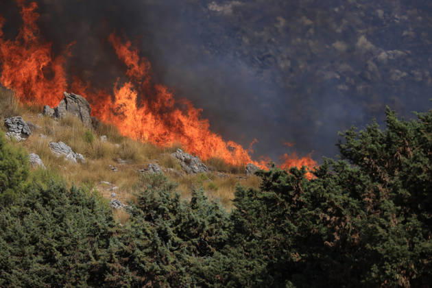 Wildfire near Palermo threatens homes in Giardinello, Sicily PALERMO, ITALY - SEPTEMBER 10: Flames and thick smoke rise from a forested area during a wildfire near Giardinello, close to Palermo on the island of Sicily, on September 10, 2026 in Palermo, Italy. The blaze began in the Carcatizzi area around midday a day earlier and spread rapidly, threatening nearby residential areas and damaging several homes. Firefighters battled the fire from the ground with fire engines and from the air with a firefighting aircraft and two helicopters. Alberto Lo Bianco Anadolu Sicily Italy. Editorial use only. Please get in touch for any other usage.  Copyright: x2026xAnadoluxAlbertoxLoxBiancox