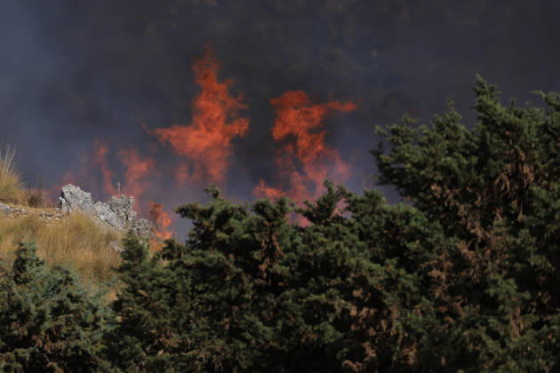 Wildfire near Palermo threatens homes in Giardinello, Sicily PALERMO, ITALY - SEPTEMBER 10: Flames and thick smoke rise from a forested area during a wildfire near Giardinello, close to Palermo on the island of Sicily, on September 10, 2026 in Palermo, Italy. The blaze began in the Carcatizzi area around midday a day earlier and spread rapidly, threatening nearby residential areas and damaging several homes. Firefighters battled the fire from the ground with fire engines and from the air with a firefighting aircraft and two helicopters. Alberto Lo Bianco Anadolu Sicily Italy. Editorial use only. Please get in touch for any other usage.  Copyright: x2026xAnadoluxAlbertoxLoxBiancox