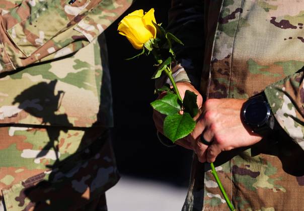 September 11, 2026, Tampa, Florida, USA: A members of the military community prepares to lay a flowers during a tribute at the end of the 9 11 25th Anniversary Memorial Service hosted by U.S. Special Operations Command (USSOCOM) to honor the 25th anniversary of the Sept. 11 terrorist attacks at the MacDill AFB Special Operations Forces Memorial on Friday, Sept. 11, 2026 in Tampa. Tampa USA - ZUMAs70_ 20260911_zan_s70_009 Copyright: xDirkxShaddx