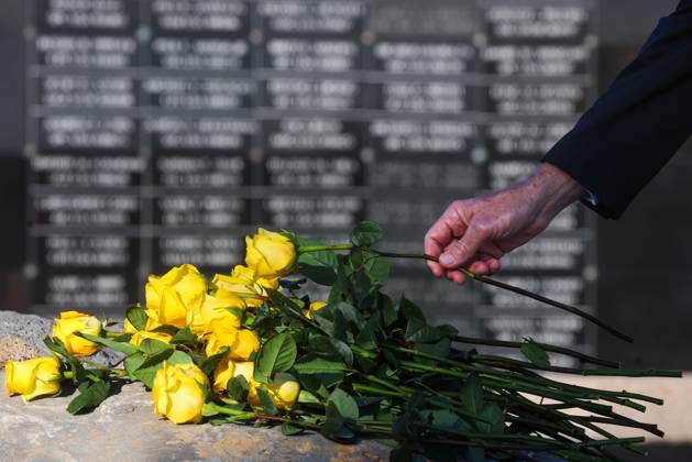 September 11, 2026, Tampa, Florida, USA: Members of the military community and guests lay flowers at the foot of the memorial with the dedicated wall honoring roughly 1,900 fallen special operations service members pictured in the background during the flower tribute at the end of the 9 11 25th Anniversary Memorial Service hosted by U.S. Special Operations Command (USSOCOM) to honor the 25th anniversary of the Sept. 11 terrorist attacks at the MacDill AFB Special Operations Forces Memorial on Friday, Sept. 11, 2026 in Tampa. Tampa USA - ZUMAs70_ 20260911_zan_s70_012 Copyright: xDirkxShaddx