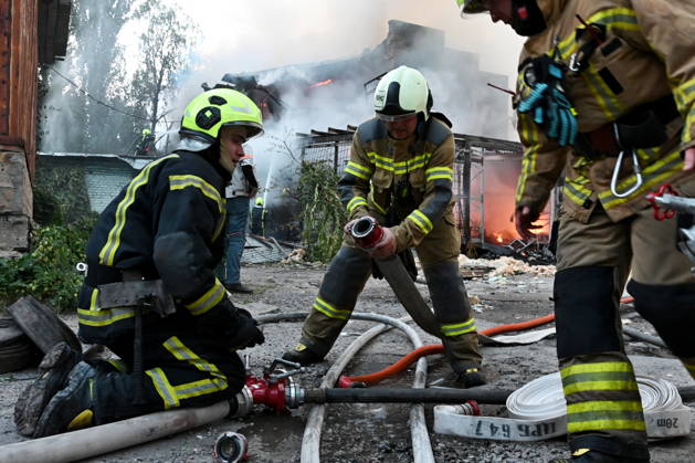 Russian Air Attack On Kyiv, Ukraine Firefighters work near the scene of a fire after a jet-powered drone struck an office building in Kyiv s Podilskyi district, on September 11, 2026. Kyiv Ukraine  Copyright: xOleksandrxGusevx originalFilename: gusev-notitle260911_npf6M.jpg