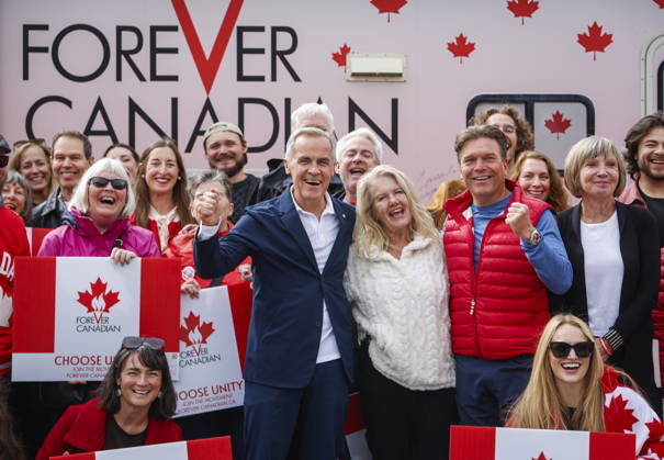 September 11, 2026, Banff, Ab, CANADA: Prime Minister Mark Carney, centre left, volunteer Fran Milburn, centre, and Forever Canadian founder Thomas Lukaszuk, centre right, pose for a group photo with volunteers following a cabinet retreat in Banff, Alta., Friday, Sept. 11, 2026. Banff CANADA  - ZUMAc35_ 20260911_zaf_c35_116 Copyright: xJeffxMcintoshx