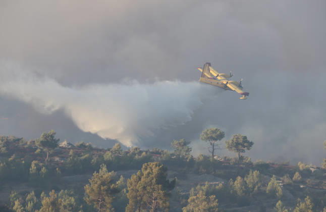 Croatia Island Wildfire A Croatian Canadair CL-415 firefighting plane drops water on a wildfire near city Milna at Island Brac, Croatia on September 12, 2026.  IvoxCagalj PIXSELL