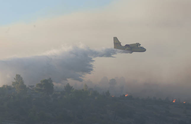 Croatia Island Wildfire A Croatian Canadair CL-415 firefighting plane drops water on a wildfire near city Milna at Island Brac, Croatia on September 12, 2026.  IvoxCagalj PIXSELL
