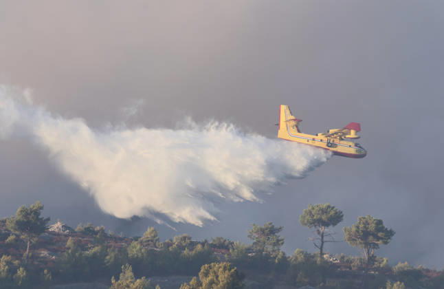 Croatia Island Wildfire A Croatian Canadair CL-415 firefighting plane drops water on a wildfire near city Milna at Island Brac, Croatia on September 12, 2026.  IvoxCagalj PIXSELL