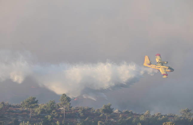 Croatia Island Wildfire A Croatian Canadair CL-415 firefighting plane drops water on a wildfire near city Milna at Island Brac, Croatia on September 12, 2026.  IvoxCagalj PIXSELL