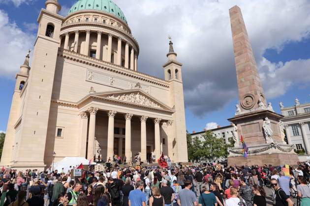 Protesters in front of St. Nicholas Church during a demonstration calling for the Federal Constitutional Court to review far-right parties, Alter Markt, Potsdam, September 12, 2026 Protest in Potsdam
