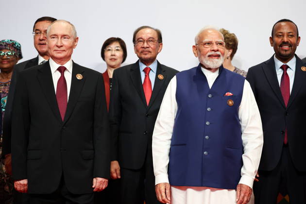 INDIA, NEW DELHI - SEPTEMBER 13, 2026: Vladimir Putin, President of Russia, and Narendra Modi (L-R front), Prime Minister of India, pose during a group photo op for an outreach session of the 2026 BRICS Summit. Alexander Kazakov Russian Presidential Press and Information Office TASS  97637617