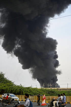 NEW DELHI, INDIA - SEPTEMBER 13: A fire breaks out at a plywood warehouse in Dallupura, East Delhi, sending thick smoke into the sky that is visible from several kilometres away, on September 13, 2026 in New Delhi, India. The fire department received a call about the blaze at 3.20 pm, following which 12 fire tenders were rushed to the spot. Firefighters were present at the site and were working to control the blaze. (Photo by Sanjeev Verma Hindustan Times ) Massive Fire Breaks Out At Delhi Plywood Warehouse, 12 Fire Tenders Rushed