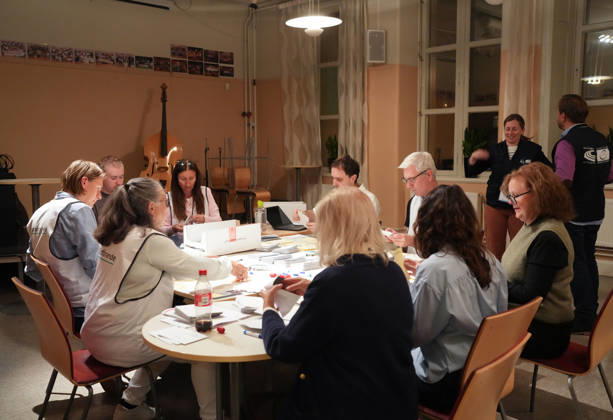 (260914) -- STOCKHOLM, Sept. 14, 2026 -- Staff members count ballots at a counting station in Stockholm, Sweden, Sept. 13, 2026. Polling stations opened across Sweden on Sunday morning in a closely watched parliamentary election that could see the far-right Sweden Democrats (SD) enter government for the first time or the center-left return to power after four years in opposition. The opposition bloc held a lead over the right-wing bloc in two exit polls released after voting ended in Sunday s parliamentary election. Public broadcaster SVT s exit poll put the four opposition parties at 51.3 percent of the vote, against 46.8 percent for the four right-wing parties. A separate election-day survey by TV4 showed a similar picture, giving 