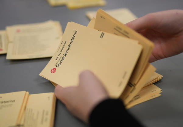 (260914) -- STOCKHOLM, Sept. 14, 2026 -- A staff member works at a counting station in Stockholm, Sweden, Sept. 13, 2026. Polling stations opened across Sweden on Sunday morning in a closely watched parliamentary election that could see the far-right Sweden Democrats (SD) enter government for the first time or the center-left return to power after four years in opposition. The opposition bloc held a lead over the right-wing bloc in two exit polls released after voting ended in Sunday s parliamentary election. Public broadcaster SVT s exit poll put the four opposition parties at 51.3 percent of the vote, against 46.8 percent for the four right-wing parties. A separate election-day survey by TV4 showed a similar picture, giving the opp 