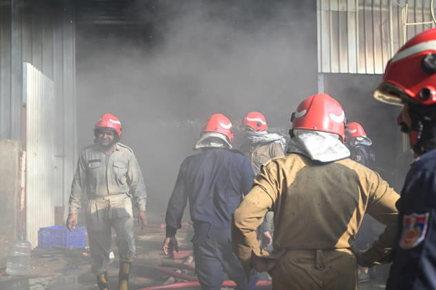 NEW DELHI, INDIA - SEPTEMBER 13: Firefighters work to extinguish a massive blaze at a plywood warehouse in Dallupura, East Delhi, as thick plumes of smoke billow into the sky and remain visible from several kilometres away, on September 13, 2026 in New Delhi, India. The fire department received a call about the blaze at 3.20 pm, following which 12 fire tenders were rushed to the spot. Firefighters were present at the site and were working to control the blaze. (Photo by Sunil Ghosh Hindustan Times ) Massive Fire Breaks Out At Delhi Plywood Warehouse, 12 Fire Tenders Rushed