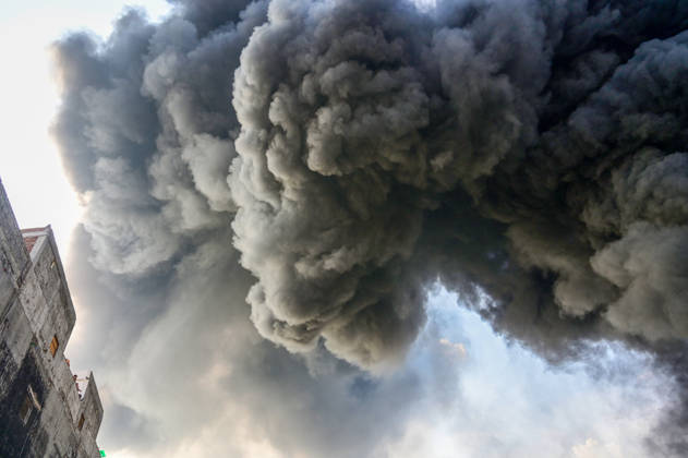 NEW DELHI, INDIA - SEPTEMBER 13: Firefighters work to extinguish a massive blaze at a plywood warehouse in Dallupura, East Delhi, as thick plumes of smoke billow into the sky and remain visible from several kilometres away, on September 13, 2026 in New Delhi, India. The fire department received a call about the blaze at 3.20 pm, following which 12 fire tenders were rushed to the spot. Firefighters were present at the site and were working to control the blaze. (Photo by Sunil Ghosh Hindustan Times ) Massive Fire Breaks Out At Delhi Plywood Warehouse, 12 Fire Tenders Rushed