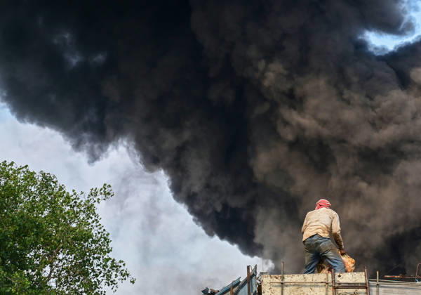 NEW DELHI, INDIA - SEPTEMBER 13: Firefighters work to extinguish a massive blaze at a plywood warehouse in Dallupura, East Delhi, as thick plumes of smoke billow into the sky and remain visible from several kilometres away, on September 13, 2026 in New Delhi, India. The fire department received a call about the blaze at 3.20 pm, following which 12 fire tenders were rushed to the spot. Firefighters were present at the site and were working to control the blaze. (Photo by Sunil Ghosh Hindustan Times ) Massive Fire Breaks Out At Delhi Plywood Warehouse, 12 Fire Tenders Rushed