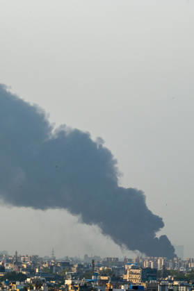 NEW DELHI, INDIA - SEPTEMBER 13: A fire breaks out at a plywood warehouse in Dallupura, East Delhi, sending thick smoke into the sky that is visible from several kilometres away, on September 13, 2026 in New Delhi, India. The fire department received a call about the blaze at 3.20 pm, following which 12 fire tenders were rushed to the spot. Firefighters were present at the site and were working to control the blaze. (Photo by Sunil Ghosh Hindustan Times ) Massive Fire Breaks Out At Delhi Plywood Warehouse, 12 Fire Tenders Rushed